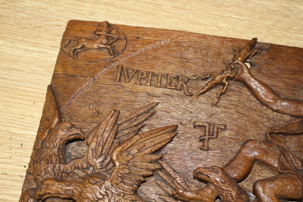 A 19th century Continental relief carved oak plaque depicting Jupiter riding in a chariot pulled by eagles, 25 x 34cm